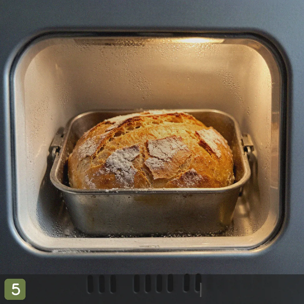 Bread machine sourdough step 5: baked crusty loaf cooling
